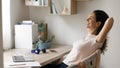 Close up smiling woman relaxing, stretching in comfortable chair Royalty Free Stock Photo