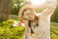 Close up of smilng young girl in summer hat spending time at the park