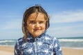 Close up smily girl posing in the beach in a windy day in Easter Royalty Free Stock Photo