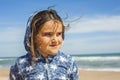 Close up smily girl posing in the beach in a windy day in Easter Royalty Free Stock Photo