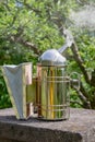 A close-up of a smoker, a beekeeperÃ¢â¬â¢s tool used to calm honey bees