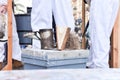 Close-up of smoker with lid open over a beehive.