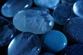 Close up of smooth blue glass pebbles with intricate patterns Royalty Free Stock Photo