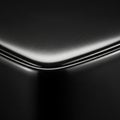 A close-up of a smooth, rounded black object with a glossy finish. The image focuses Royalty Free Stock Photo