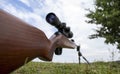 Close up Sniper Carbine Outdoors. A Man Aims his Rifle at the Forest. A rifle with a Mammal-detecting Scope. A Weapon Made of Royalty Free Stock Photo