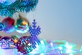 Close up snowflake and christmas balls hanging on the branch of the pine Royalty Free Stock Photo
