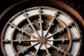 Close-up of a snowflake on a wagon wheel Royalty Free Stock Photo