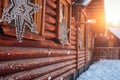 close-up of snowflakes on cabins wooden exterior