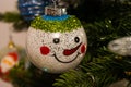Close up of a snowman Christmas decoration hanging on the Christmas tree