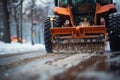 Close-up of a snowplow in action on a city street, capturing the essence of winter maintenance work Royalty Free Stock Photo