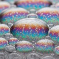 Close-up of soap bubbles displaying vibrant iridescent patterns. The bubbles vary in Royalty Free Stock Photo