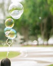 Close up Soap bubbles floating in the garden park. Royalty Free Stock Photo