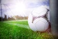 Close-up of soccer ball near a goal post