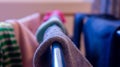 Close up of sock drying on a rack, daytime. Depicting laundry day, cleaning, house chores and missing sock pairs