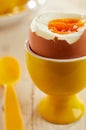Close-up on soft-boiled egg in eggcup
