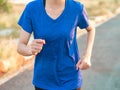 Close up soft focus of young woman running outdoor in the park Royalty Free Stock Photo