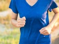 Close up soft focus of young woman running outdoor in the park Royalty Free Stock Photo