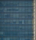 Close-up soft light pattern glass wall facade exterior architecture building reflection blue sky clean environment background. Royalty Free Stock Photo