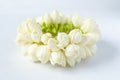 Close up soft white natural jasmine flower garland on white background