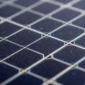 Close-up of a solar panel surface, featuring an array of interconnected photovoltaic cells. The Royalty Free Stock Photo