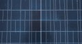 Close-up of a solar panel surface, featuring a grid of dark blue photovoltaic cells with Royalty Free Stock Photo