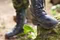 Close up of soldier feet with army boots in forest Royalty Free Stock Photo