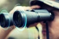 Close up of soldier or hunter with binocular