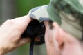 Close up of soldier or hunter with binocular