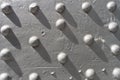solid silver steel plate screw heads shadows Royalty Free Stock Photo