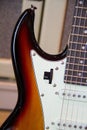 Close up of a solid sunburst from black to brown electric guitar Royalty Free Stock Photo