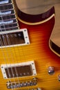 Close up of a solid sunburst from orange to yellow electric guitar Royalty Free Stock Photo