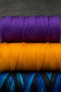 Close up of some different colorful rolls of thread