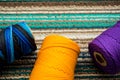 Close up of some different colorful rolls of thread