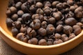 Close-up of some dried tea fruits. Dried tea fruit in a wooden plate. Royalty Free Stock Photo