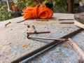 a close up of some iron nails on a blue table Royalty Free Stock Photo