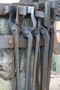 Close up of some iron tools hanging on a wall Royalty Free Stock Photo
