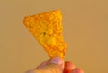 Close up of someone holding orange chilli heatwave dorito Royalty Free Stock Photo