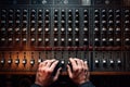 Close up of sound engineer hands working on mixing console in recording studio, Hand on a sound mixer station, top view, AI Royalty Free Stock Photo