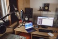 Close-up of the sound engineer, radio presenter office in recording and broadcasting studio. Focus on microphone Royalty Free Stock Photo