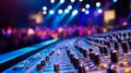 This close-up of a soundboard shows knobs and faders in dim lighting. Royalty Free Stock Photo