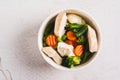 Close up of soup with chicken, cauliflower, broccoli, carrots and green beans in a bowl top view Royalty Free Stock Photo