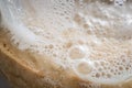 close-up of sourdough starter with flour, water, and bubbles