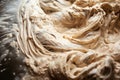 close-up of sourdough starter, swirling masses of yeast and bacteria