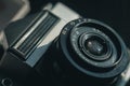 Close-up of the Soviet manual lens Industar 50-2 on a film camera. Black background, copy space, deep shadows Royalty Free Stock Photo