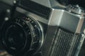 Close-up of the Soviet manual lens Industar 50-2 on a film camera. Black background, copy space, deep shadows Royalty Free Stock Photo