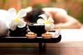 Close up Spa items. Background asian woman lying down on massage bed with scrub suga