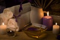 Close-up. Spa still life. Sea salt bath, candles, flowers and towels. Body Oil. Royalty Free Stock Photo