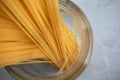 Close-up spaghetti in glass jar. Ingredient for Italian pasta. Raw food Royalty Free Stock Photo