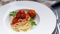 Close-Up spaghetti and meatballs in tomato sauce on a white plate Royalty Free Stock Photo