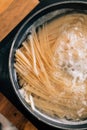 Close-up of spaghetti pasta In boiling hot water in steel pan. Preparation for making Al Dente Spaghetti. Cooking at home. Royalty Free Stock Photo